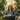 Woman sitting in a room filled with plants, with text 'THIS IS FINE' displayed.